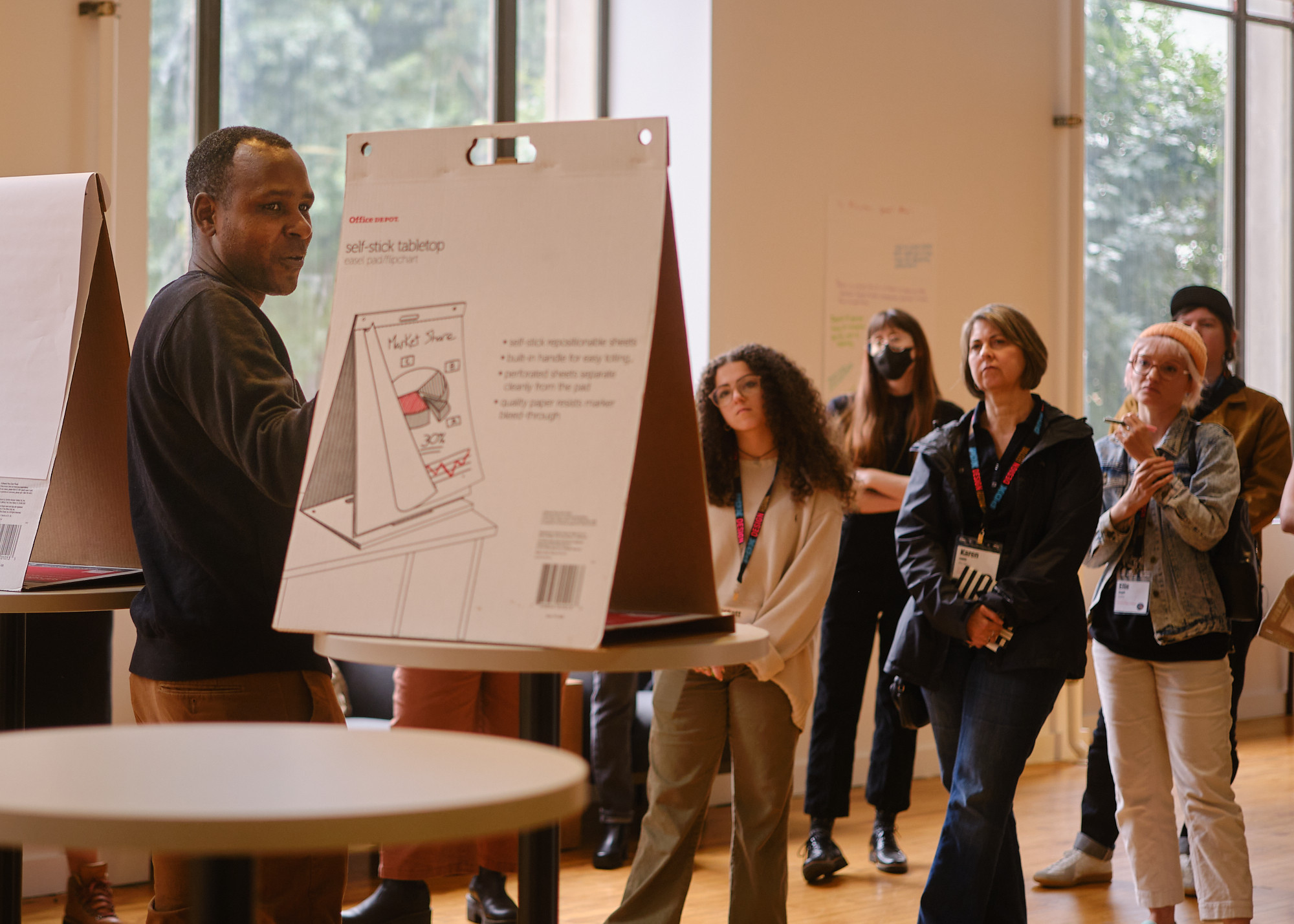 Ron Bronson leading a workshop while participants listen and take notes